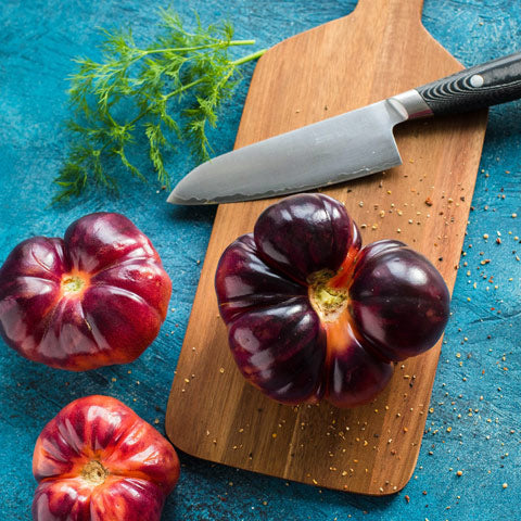 wooden chopping board with knife